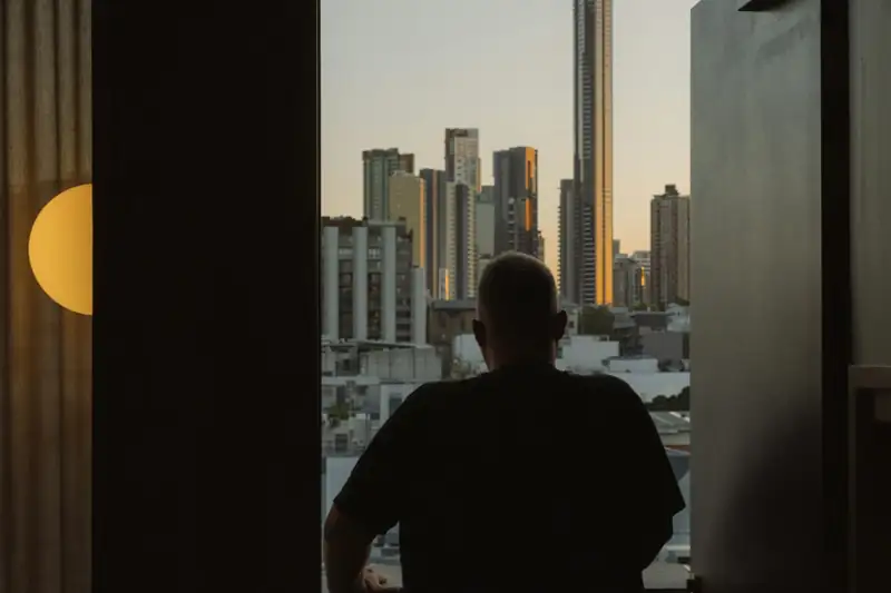 View over Brisbane city towers from a window in Fortitude Valley at dusk