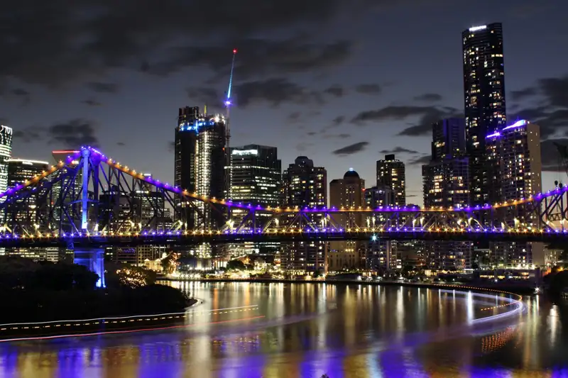 Story Bridge lit up at night, linking Brisbane city to Kangaroo Point on the southside